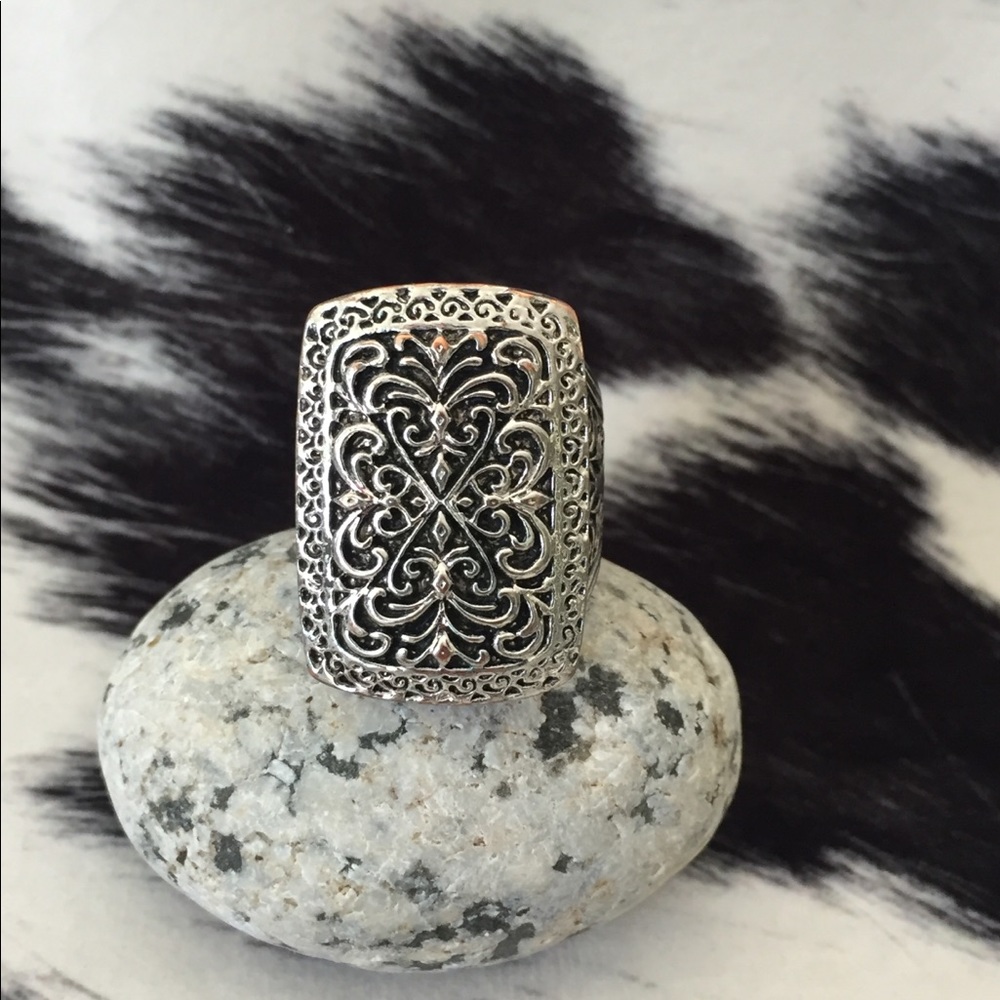 Intricate detailed silver tone ring